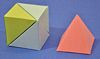pyramid and three pyramids forming a cube